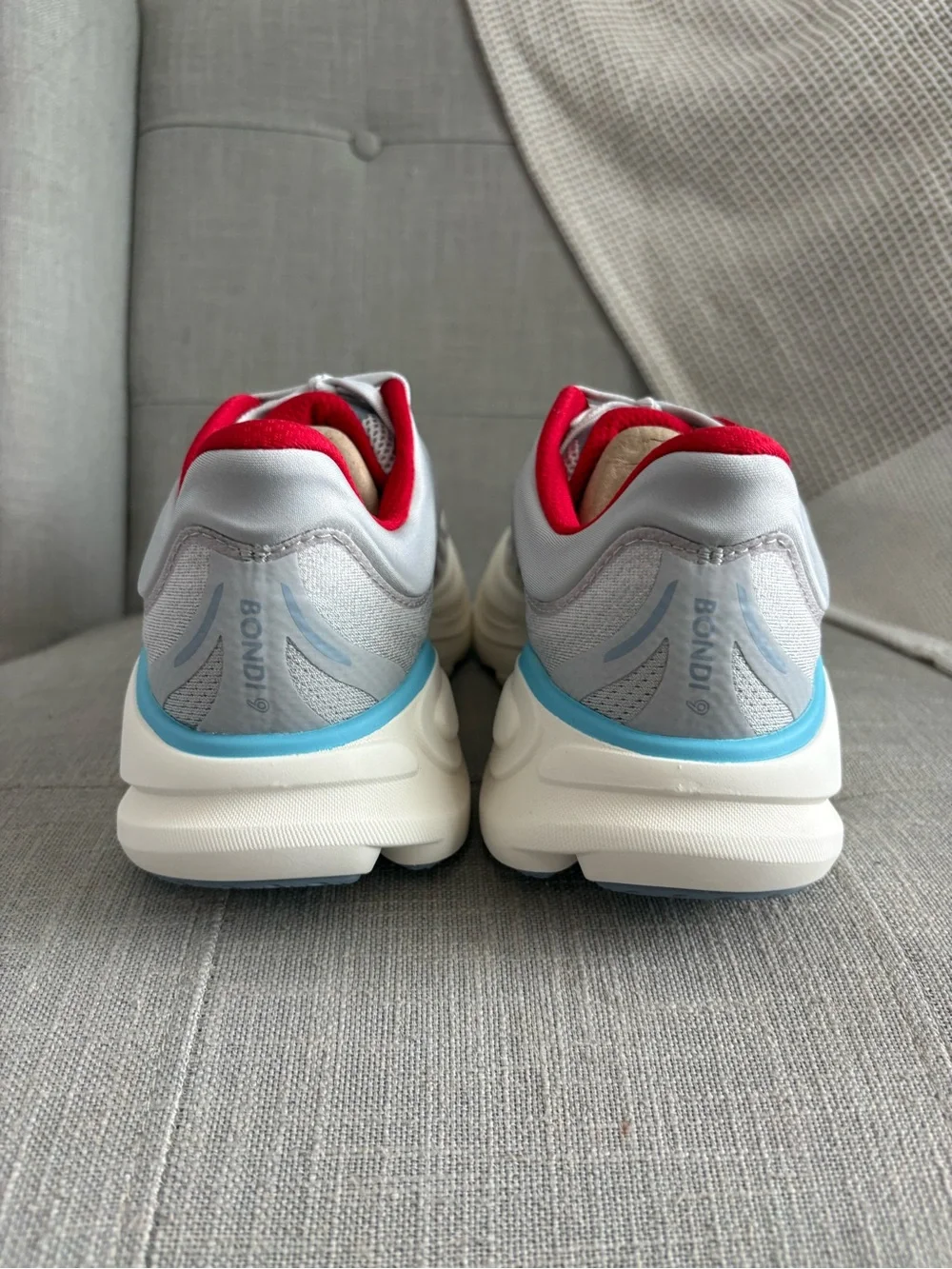 Hoka Women's Bondi 9 Light Gray Running Shoes with Red and Light Blue Accents